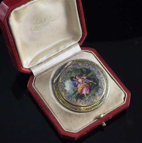 An early 20th century continental silver and yellow guilloche enamel compact in original box, 2in.